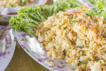 Healthy food. Seafood fried rice on wooden table. thai cuisine with selective focus.