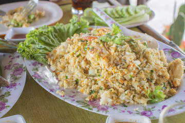 Healthy food. Seafood fried rice on wooden table. thai cuisine with selective focus.