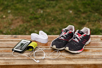 Sneakers and smartphone with headphones