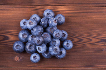 blueberries on wood background