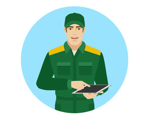 Man in uniform uses tabletdigital tablet PC