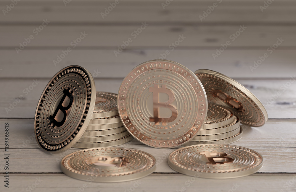 Poster stack of shiny copper bitcoins as example for blockchain and crypto currency spread across a wooden 