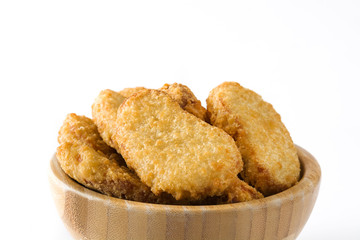 Fried chicken nuggets in bowl isolated on white background
