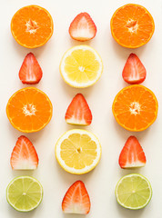 Top view of citrus fuits and strawberiesy, on the white background