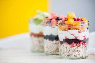 Oatmeal with fruit and cereals in a glass jar