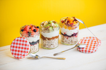 Oatmeal with fruit and cereals in a glass jar