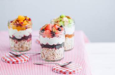 Oatmeal with fruit and cereals in a glass jar