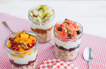 Oatmeal with fruit and cereals in a glass jar