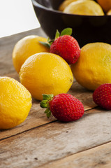 Fototapeta na wymiar Lemon and strawberries, source of vitamin C