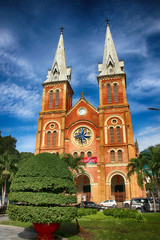 Fototapeta na wymiar Notre-Dame Cathedral Basilica of Saigon in Ho Chi Minh City (Vietnam) against a blue sky