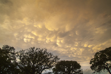 Fototapeta na wymiar Ominous storm clouds in sky at sunset