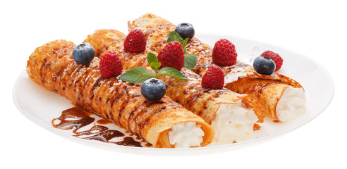 Rolled pancakes on a plate.