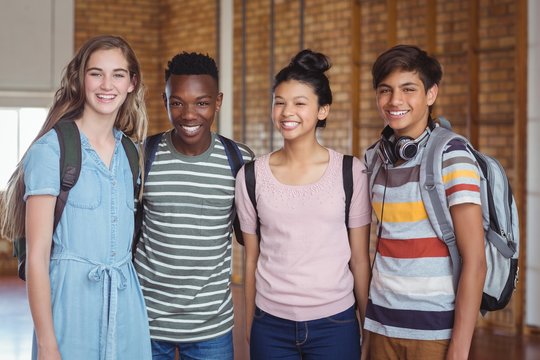 Portrait Of Happy Students Standing In Campus