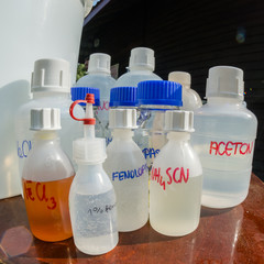 various reagents in bottles (liquids) - open air laboratory