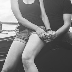 young happy loving couple on the river bank