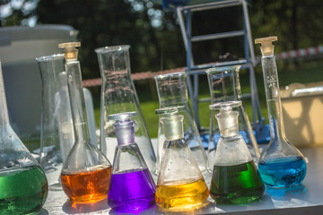 laboratory in the open air - glassware with colorful liquids