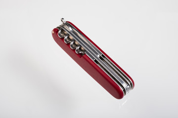 Red multitool closed knife isolated
