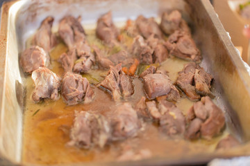 Marinated meat in a cooking pan