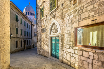 Sibenik city center Croatia. / Scenic view at narrow mediterranean streets in old city center of town Sibenik with marble cathedral in background.