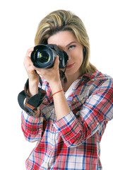 Girl photographer taking  picture in the studio, portrait of  girl with a camera on  white background. Space for text
