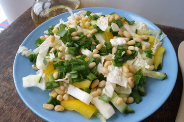 Organic, vegetarian salad from fresh vegetables with pine nuts