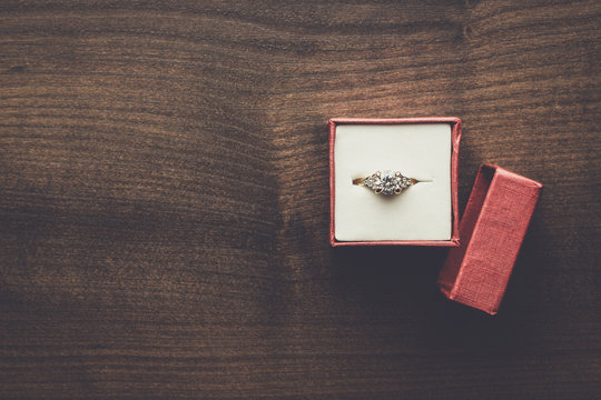 Ring In The Red Box On Wooden Table