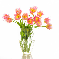 Bright spring bouquet in a vase. Springtime. Vase with tulips.