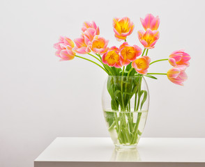 Bright spring bouquet in a vase. Springtime. Vase with tulips.
