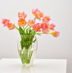 Bright spring bouquet in a vase. Springtime. Vase with tulips.