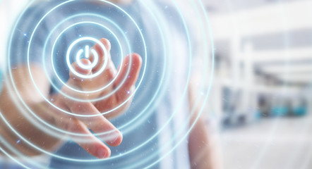 Businessman holding 3D render power button with his hand