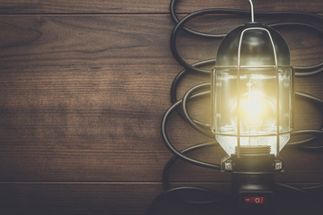 hand lamp on the brown wooden background