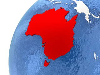 Australia on metallic globe with blue oceans