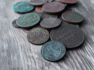 Coins on the background of old wood