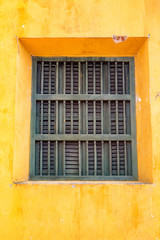 Fototapeta na wymiar Window on the Church of the Holy Trinity in the Getsemani neighborhood of Cartagena, Colombia.