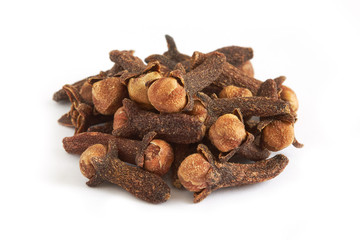 Pile of cloves isolated on white background, selective focus