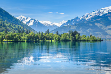 Reflection of a snowy mountain range, Zell am See, Austria © auergraphics