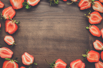 fresh strawberries on the brown wooden table