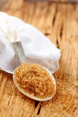 Brown sugar in spoon.