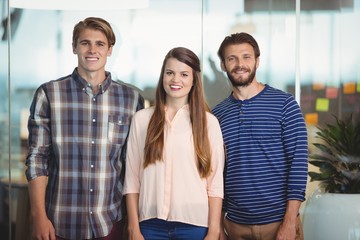 Happy executives standing in office