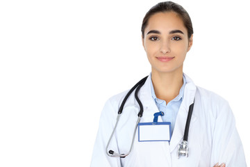 Cheerful smiling female doctor isolated over white background. Latin american or Hispanic young woman