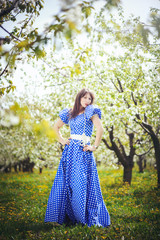 beautiful woman in a cherry orchard