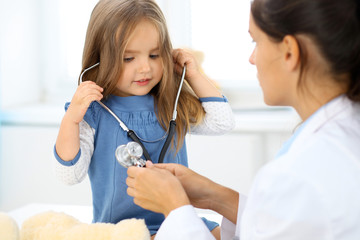 Doctor and kid patient during health exam