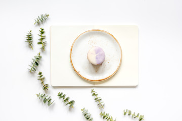 woman table with notebook, macaroons and eucalyptus top view mock-up