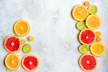 sliced citrus on stone table background top view mock up