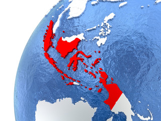 Indonesia on metallic globe with blue oceans