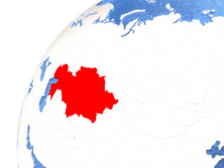 Kazakhstan on metallic globe with blue oceans