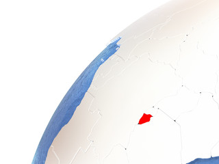 Burundi on metallic globe with blue oceans