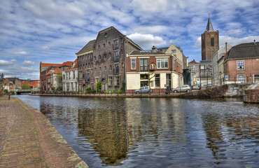 Historical buildings on a canal in Schiedam, Holland