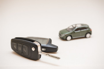 Car key, small car, money.