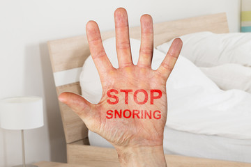 Stop Snoring Written On Hand